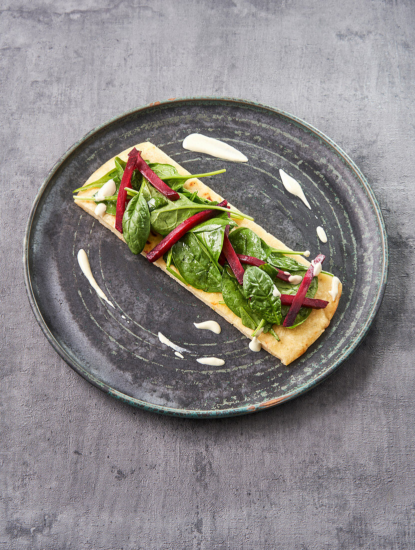Herbal pancakes with baby spinach, beetroot, and tofu cream
