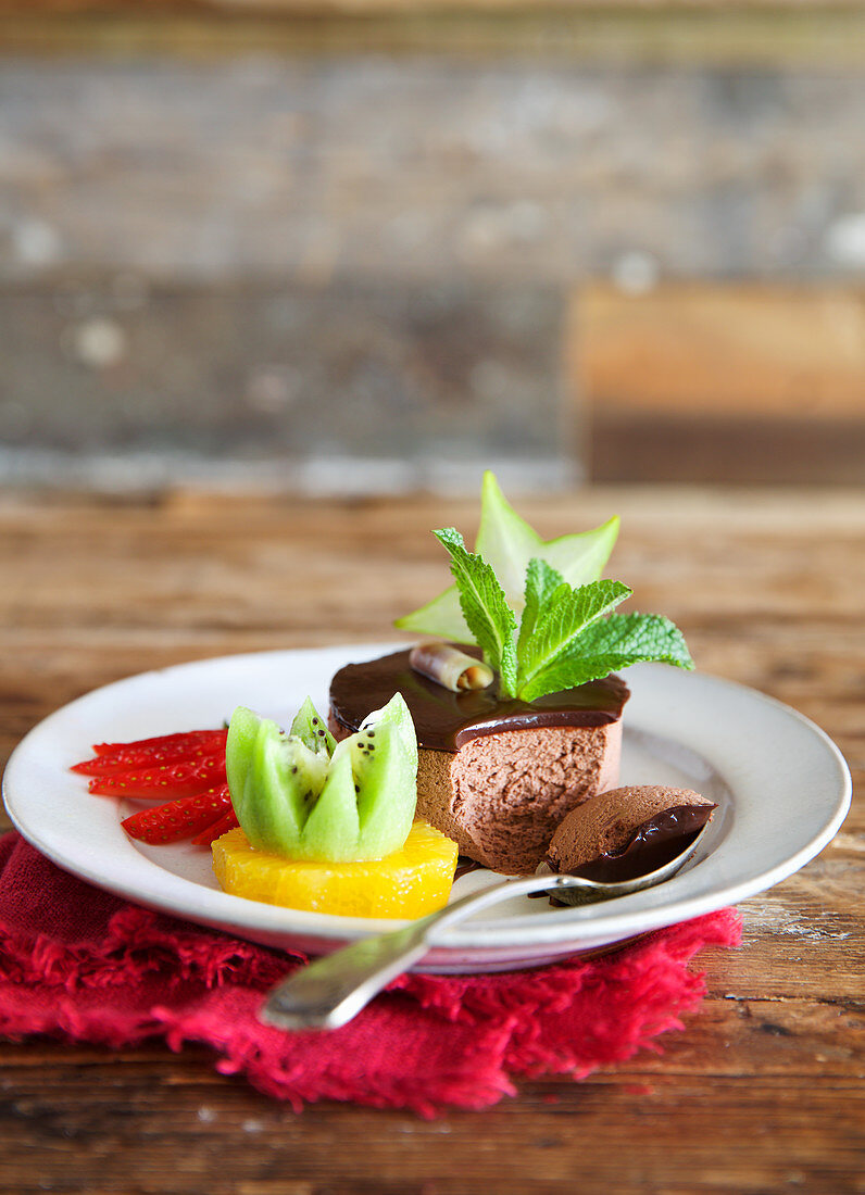 Thai chocolate dessert with fruit garnish