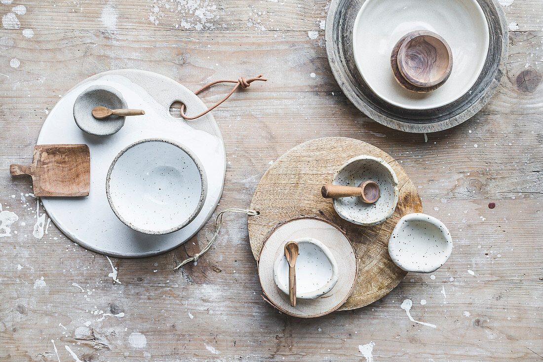 Crockery in natural shades on a wooden board