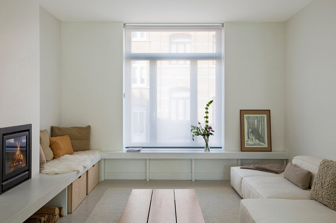 White shelves, L-shaped bench and sofa in white living room