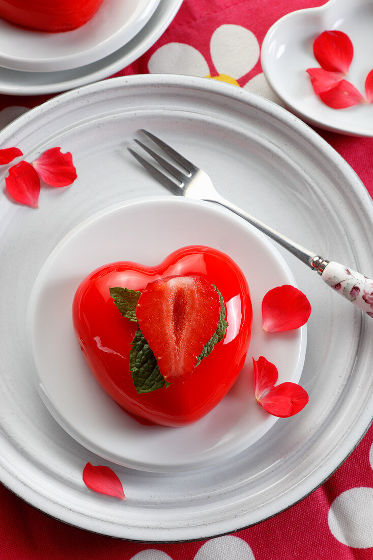 Heart-shaped strawberry dessert topped with jelly