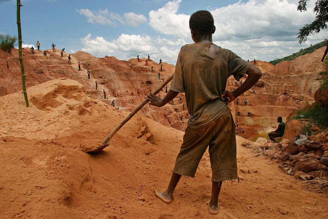 Boy working in a gold mine, Democratic Republic of Congo