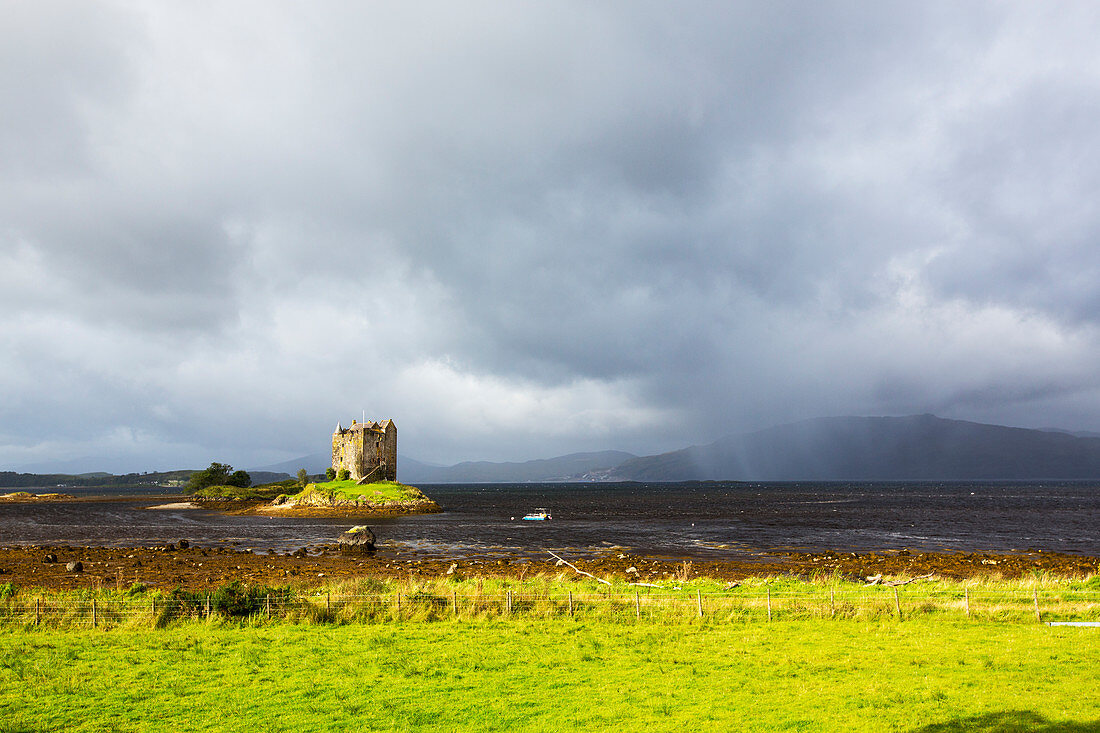 View of island castle on a lake, Scotland, UK