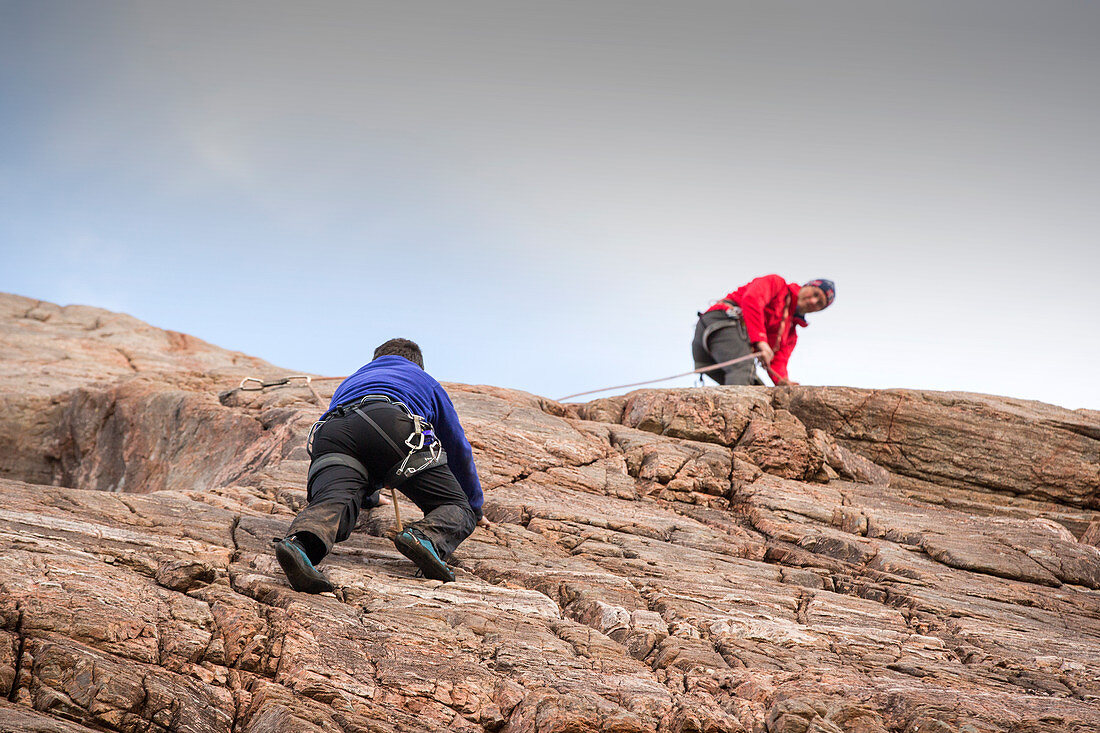 Rock climbers on a crag, Scotland, UK