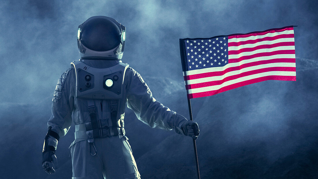 Astronaut walking with a US flag
