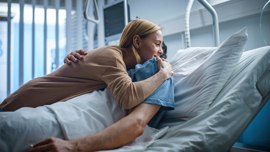 Wife visiting her recovering husband in the hospital