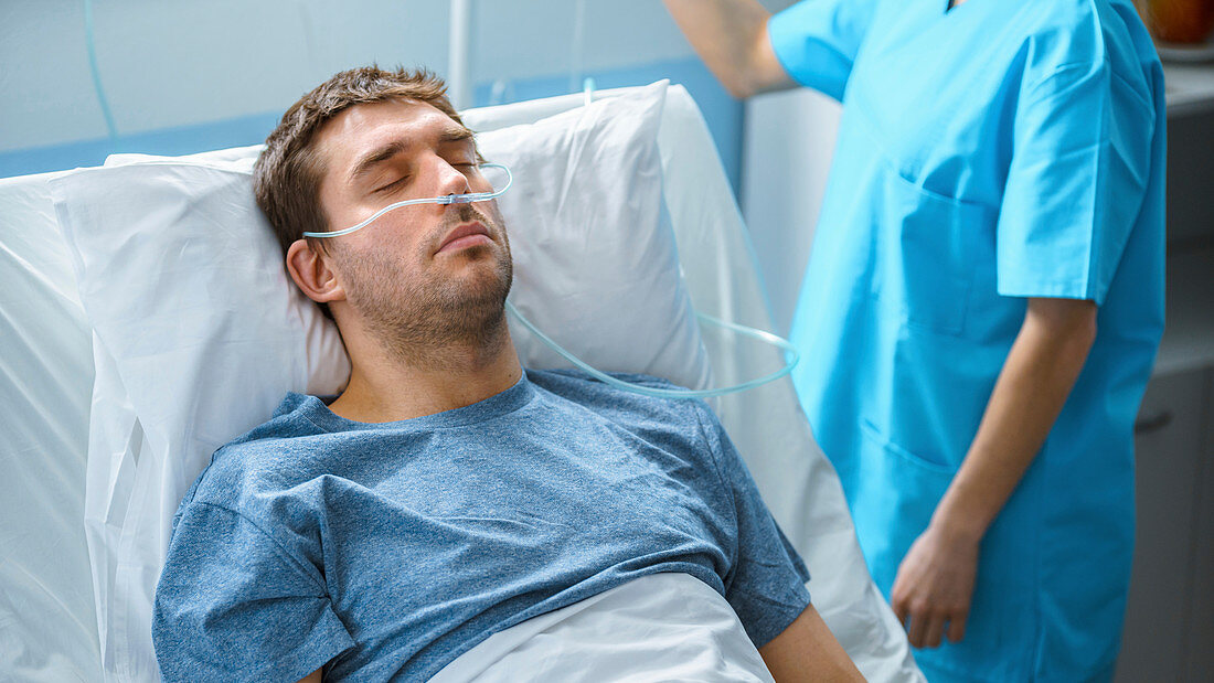 Sick patient sleeping in a hospital bed