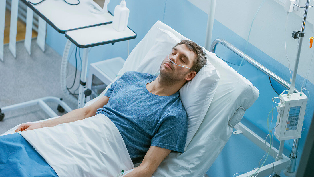 Sick patient sleeping in a hospital bed