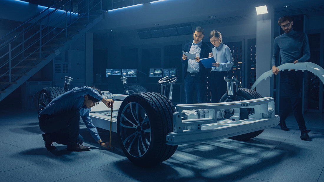 Automotive engineers working on an electric car