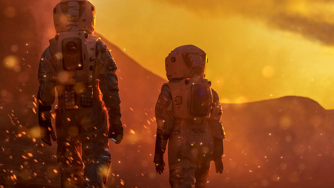 Two astronauts exploring a red, alien planet
