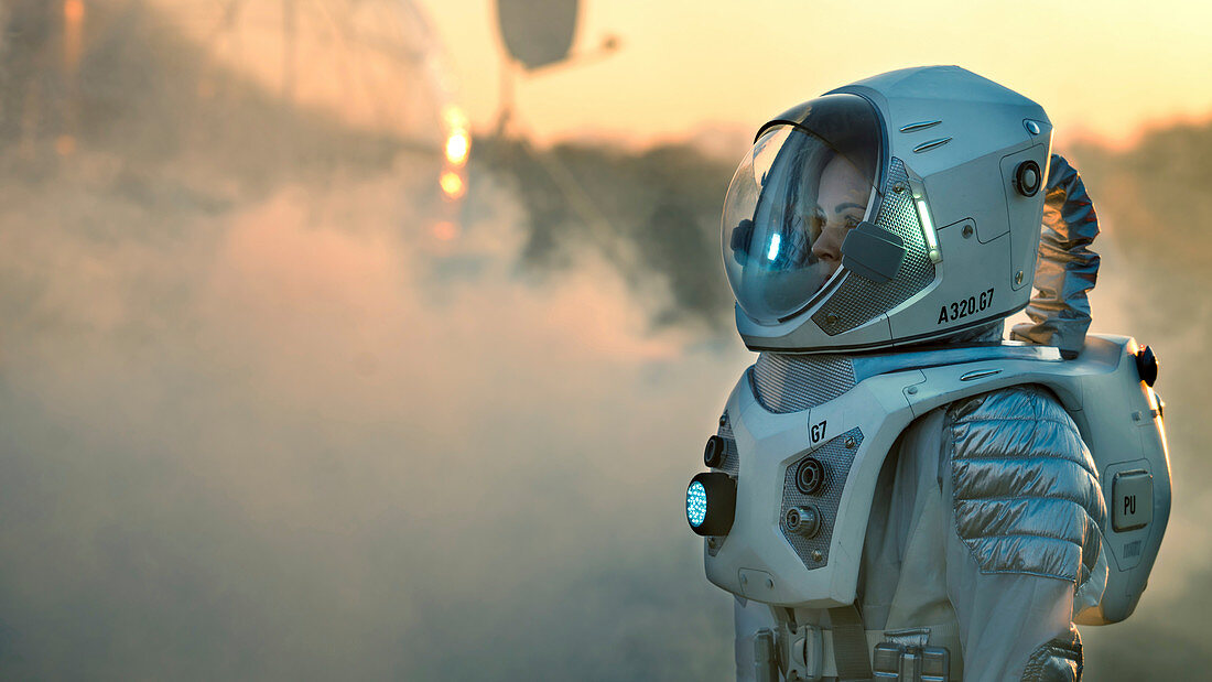 Astronaut walking toward a research base on alien planet