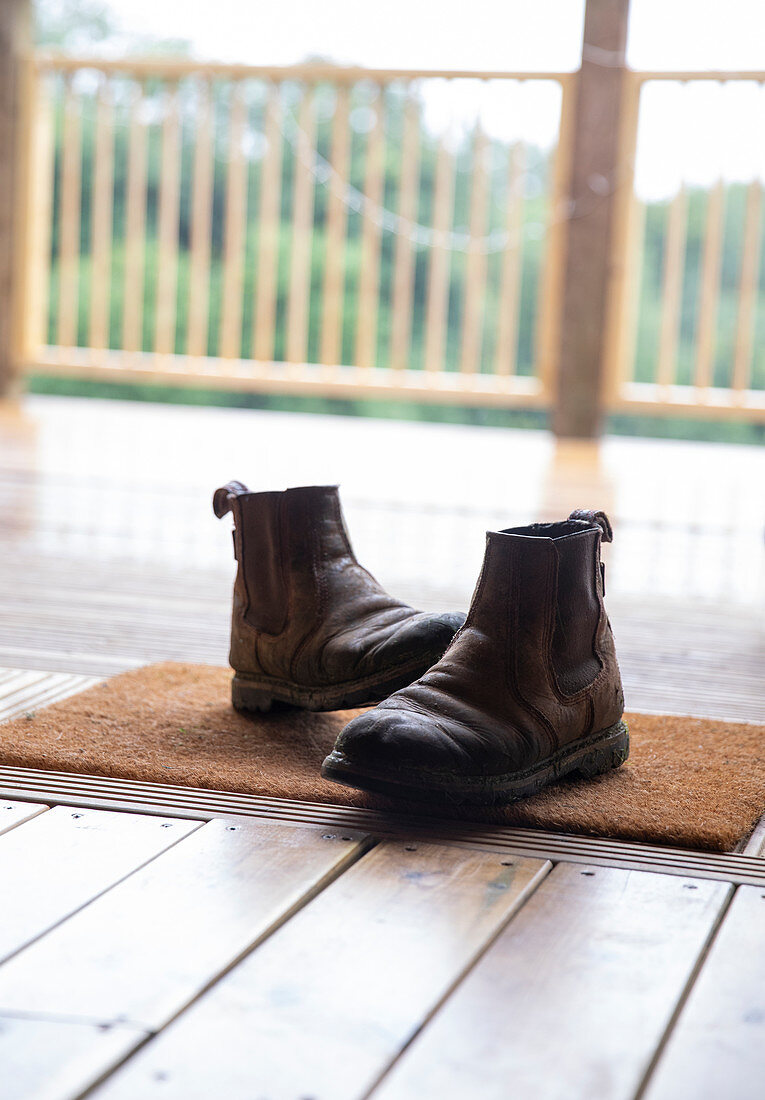 Boots on doormat in cabin doorway