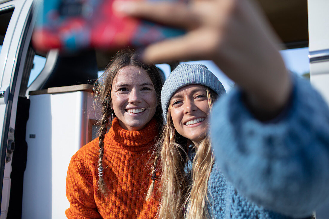 Happy friends taking selfie