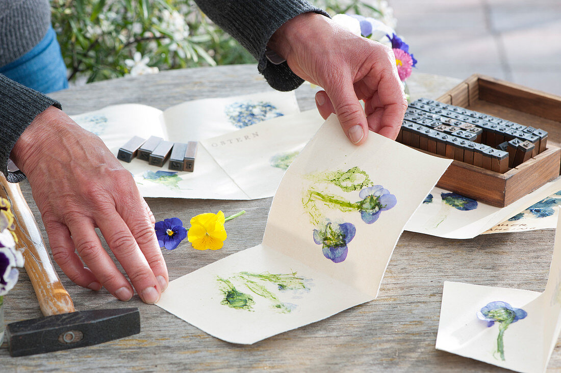 Designing greeting cards with imprinted pressed flowers