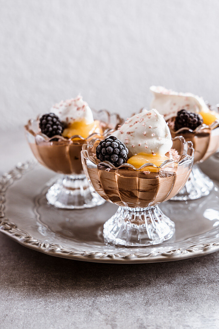 Classic chocolate mousse with whipped cream and lemon curd