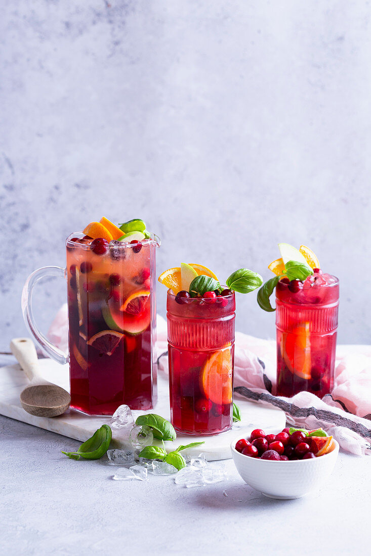 Fruit cocktail with apples, cranberries, oranges and basil