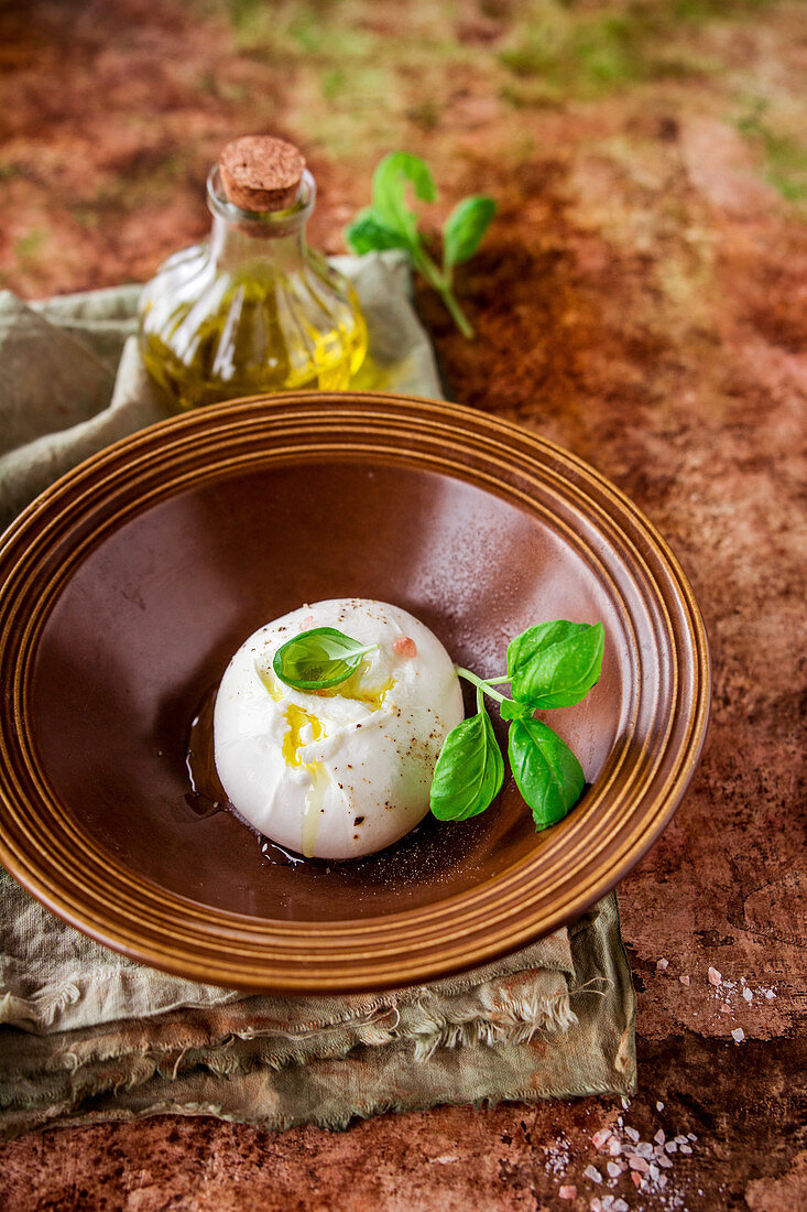 Burrata with olive oil and basil