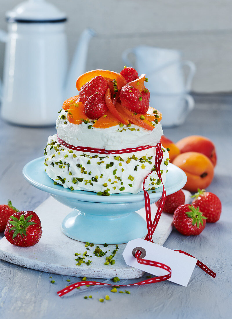 Mini birthday cake with apricots and strawberries