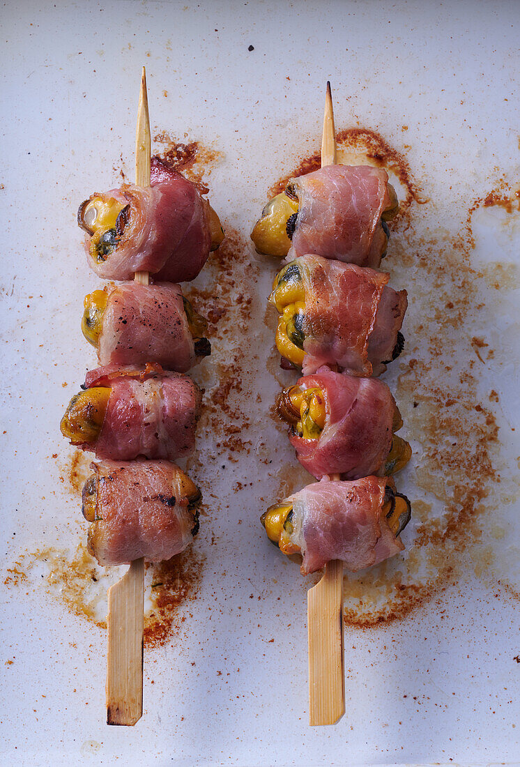 Mussel skewers wrapped in bacon
