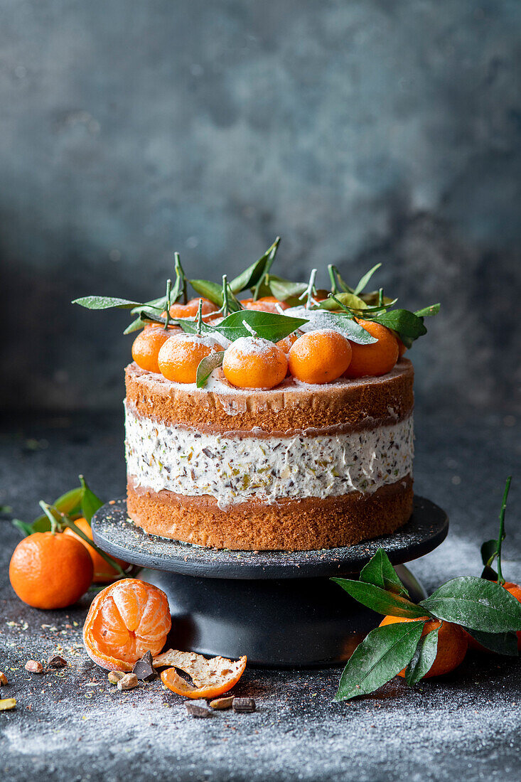 Tangerine cake with cream cheese, pistachios and chocolate chunks