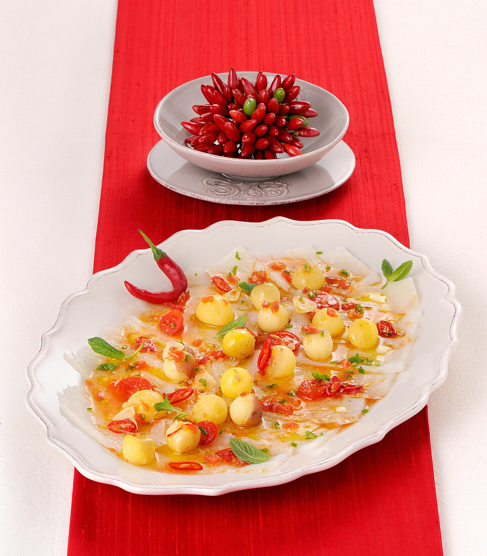 Cod carpaccio in a hot chili sauce