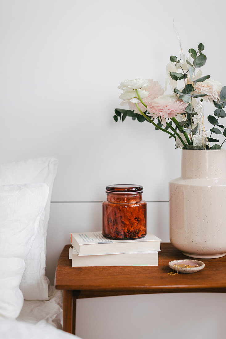 DIY room fragrance with stone pine shavings in jar on bedside table