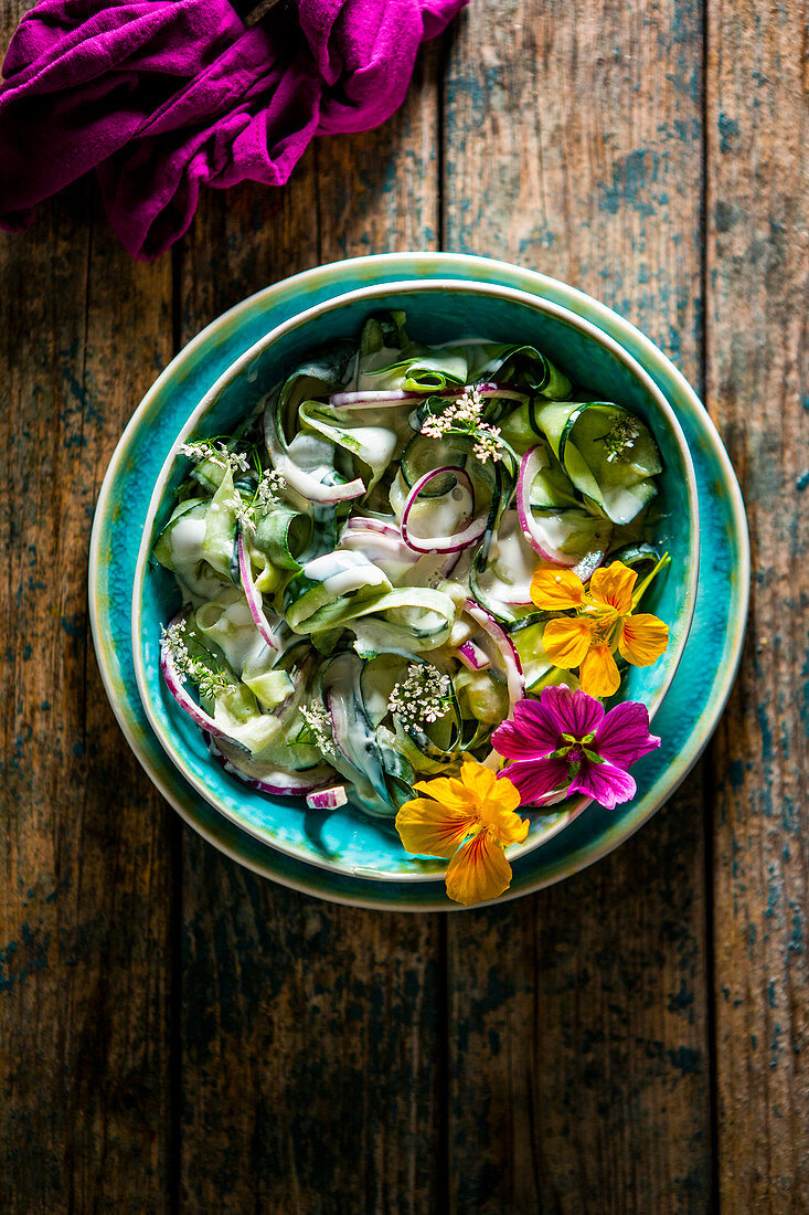 Indian Cucumber Yogurt Sauce (raita) with edible flowers