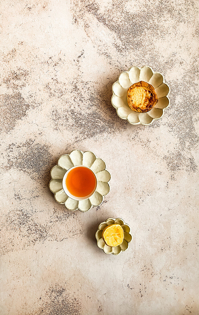 Milktart with Rooibos tea and squeezed lemon on Japanese designed ceramic saucers and bowls