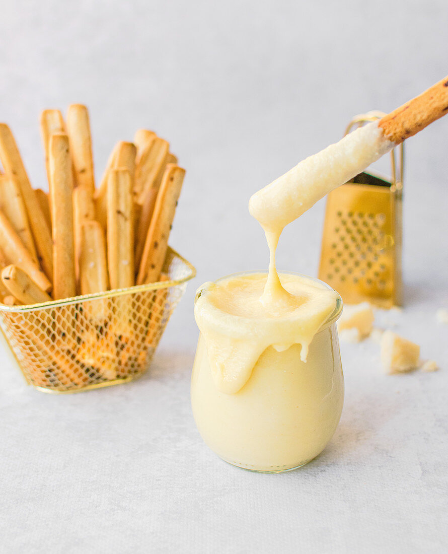 Cheese sauce as dip for Grissini