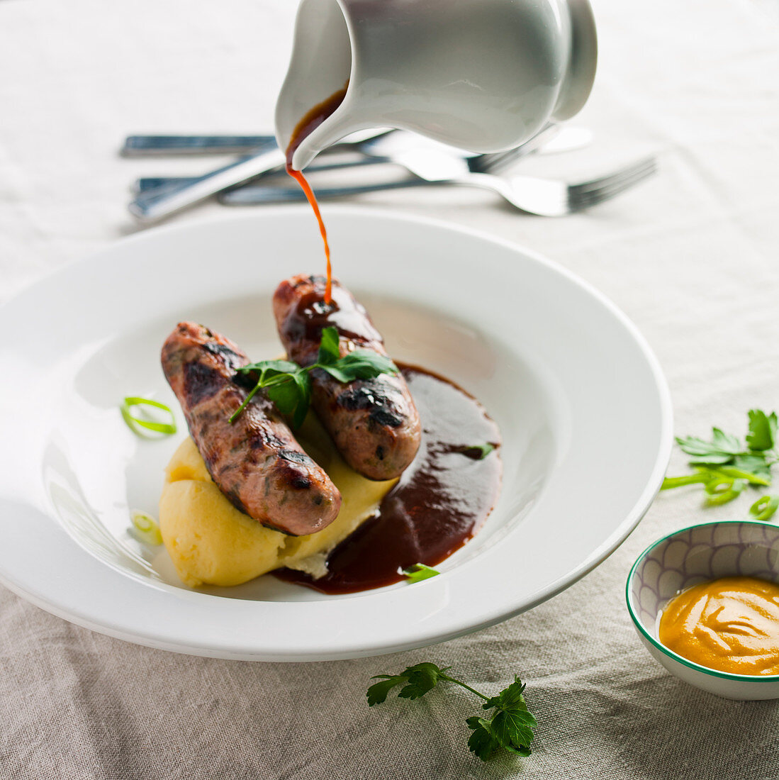 Bangers and mash with red wine gravy