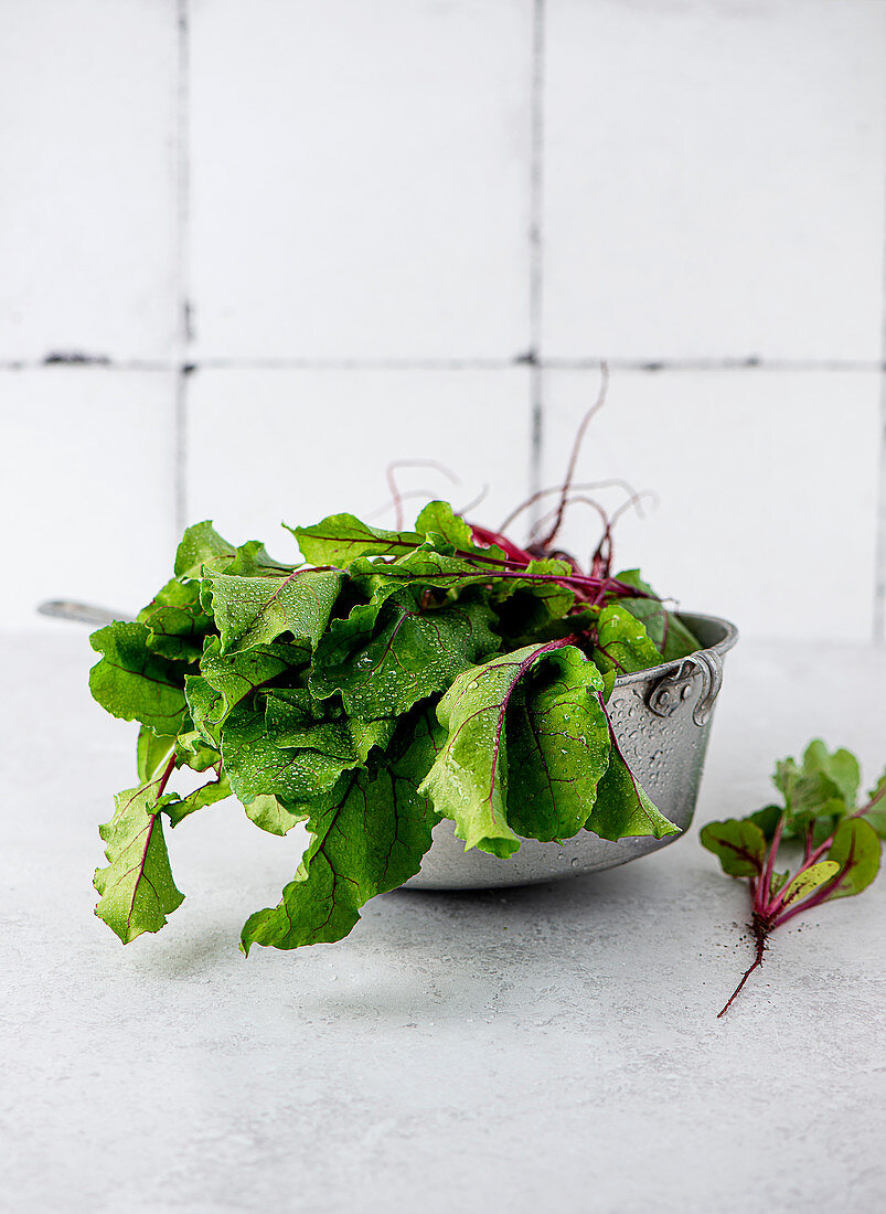 A baby beetroot with leaves