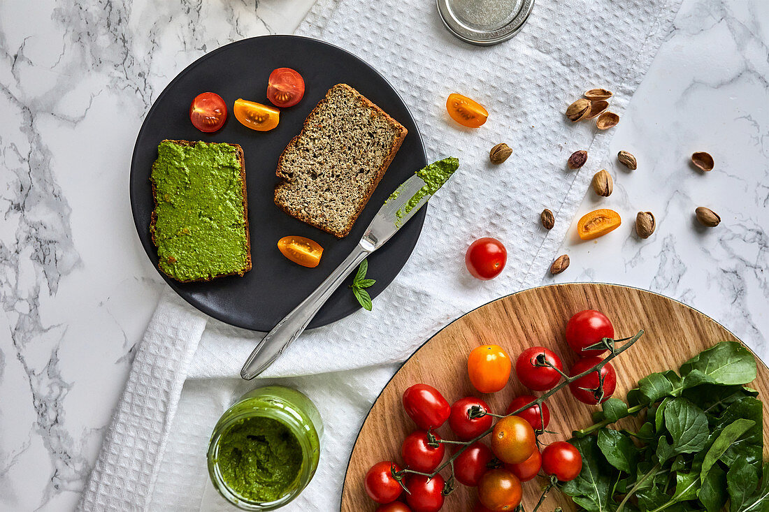 Homemade basil and arugula pesto on a piece of bread