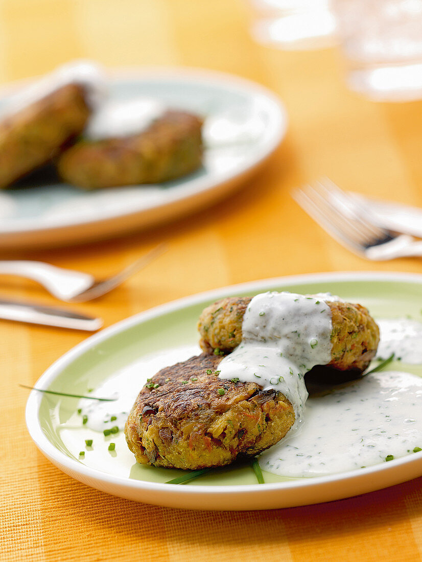 Vegetable fritters with a chive cream sauce