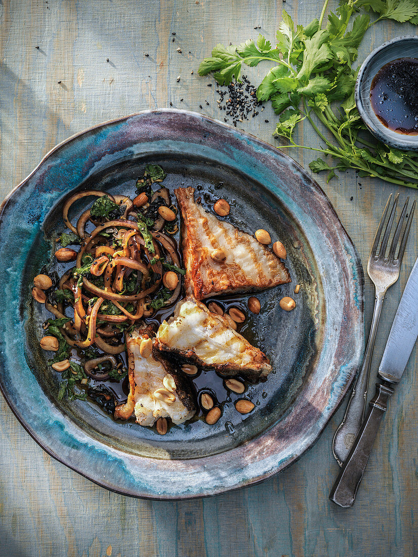 Fried turbot with sauteed greens, noodles, peanuts, and soy sauce