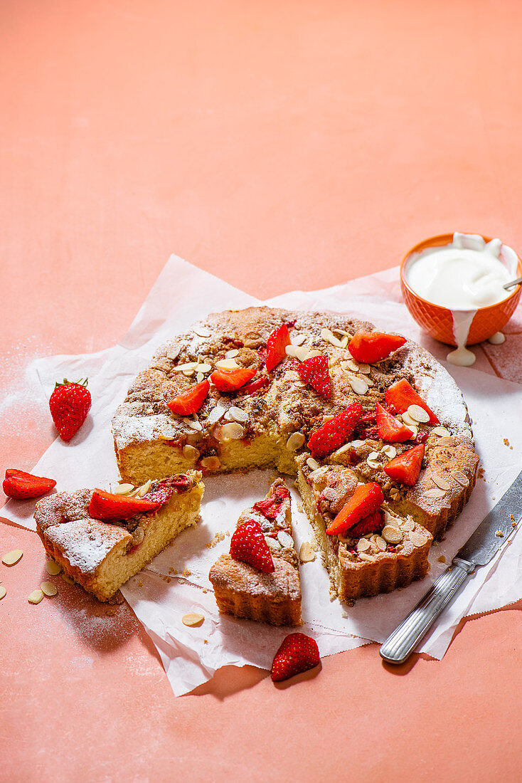 Almond sponge with strawberries and crumble topping