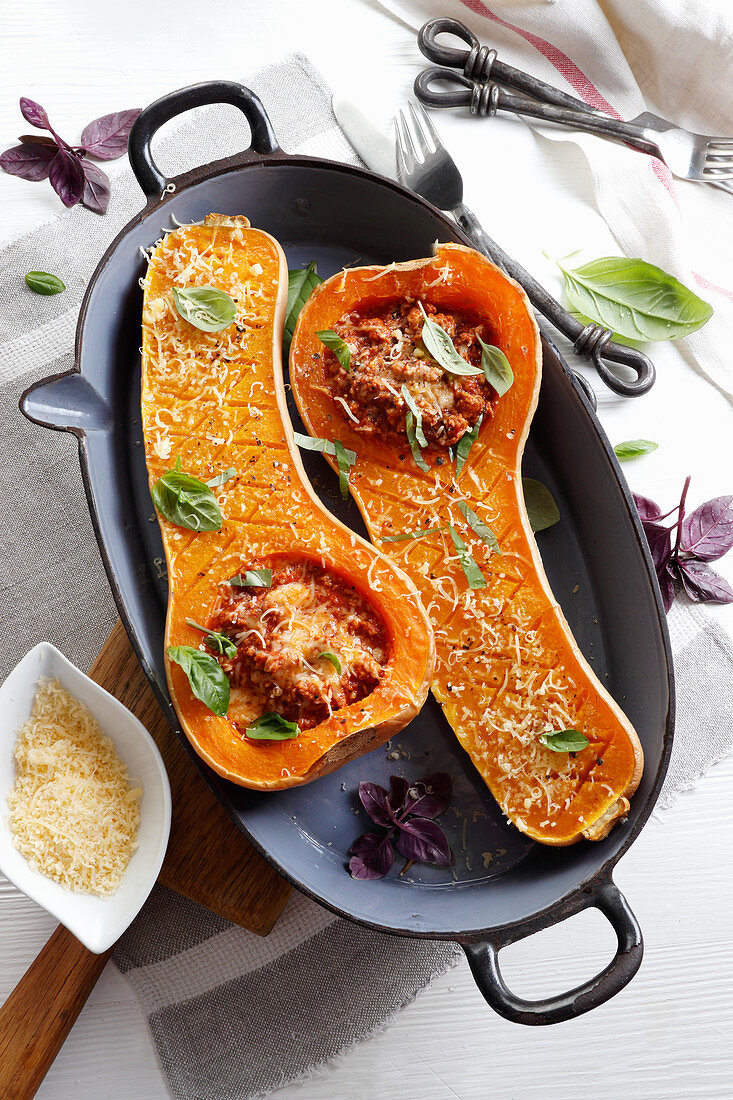 Roasted butternut squash stuffed with minced meat and cheese