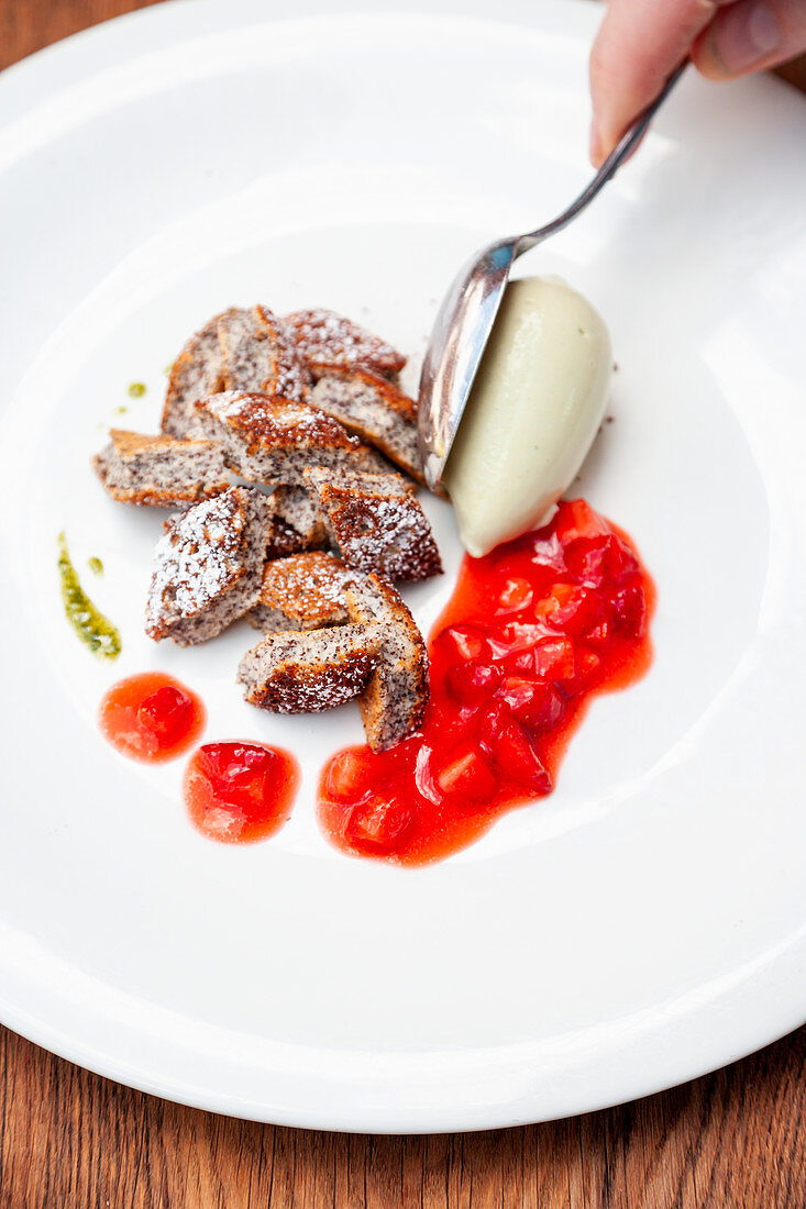 Poppy seed pancakes with coconut ice cream and marinated strawberries