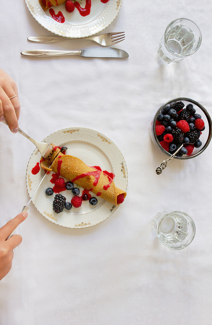 Filled banana crepes with fresh berries