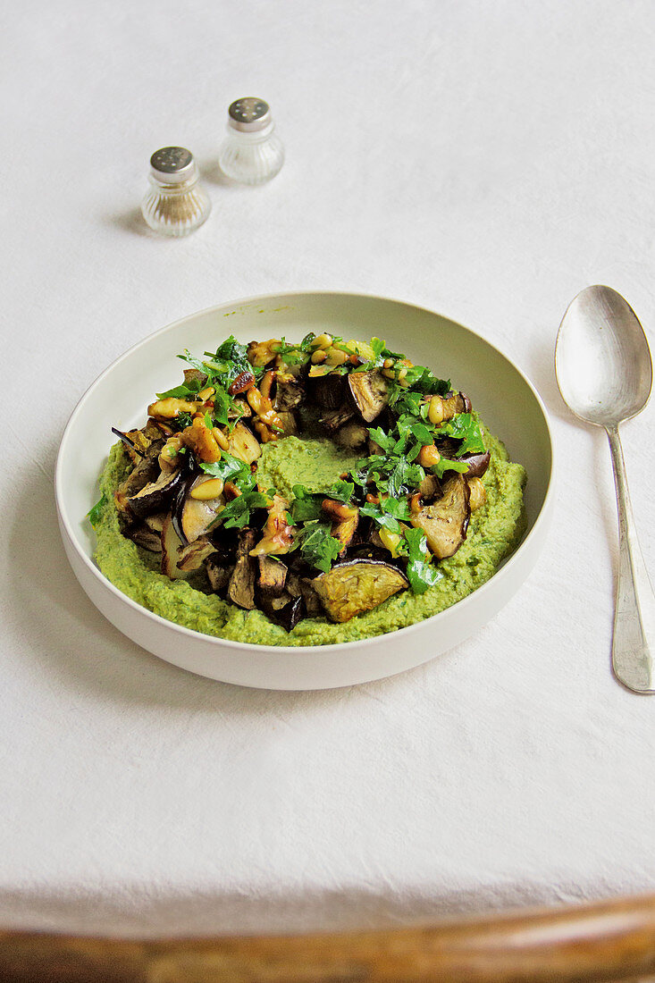 Green hummus with roasted eggplant, walnuts and parsley