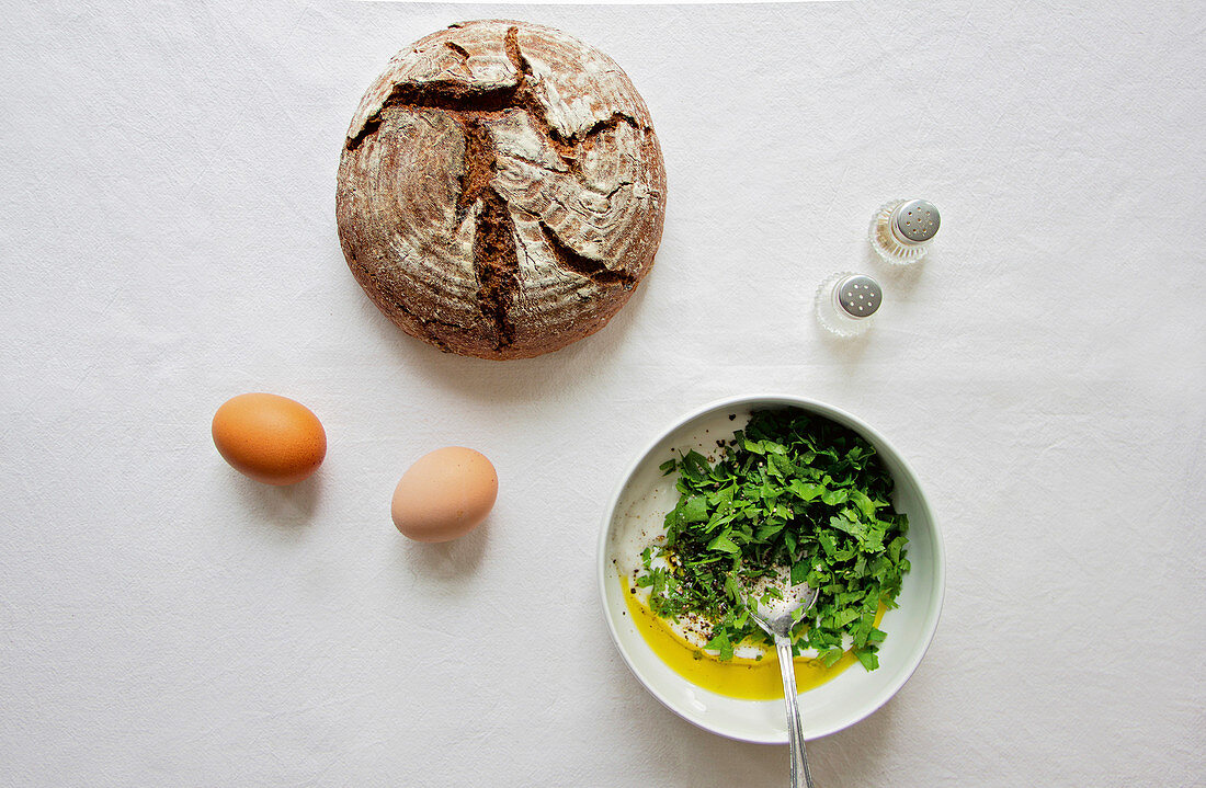 Herbal yogurt, eggs and fresh sourdough bread