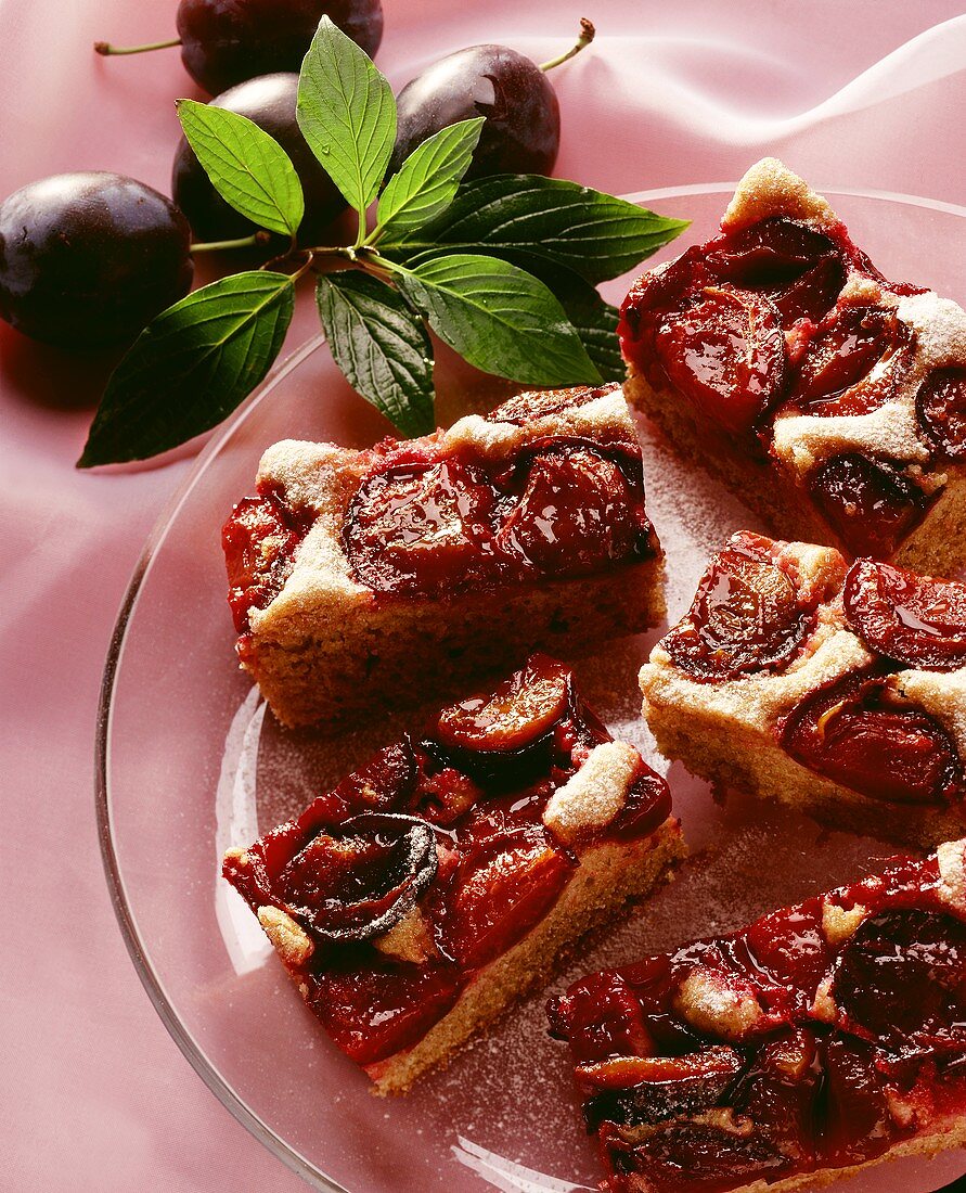 A few pieces of plum cake on glass plate