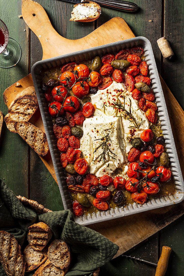 Baked feta with tomatoes, olives and rosemary