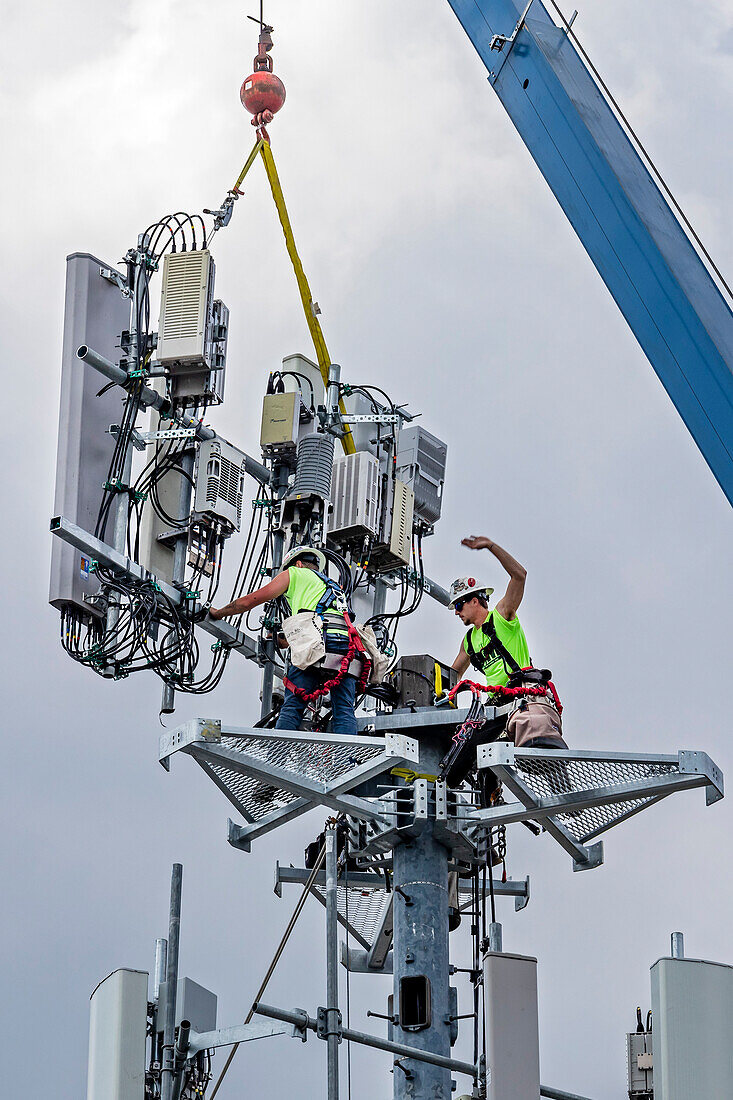 Workers upgrading a cell tower
