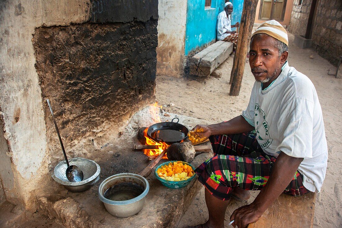 Man cooking, Lamu, Kenya