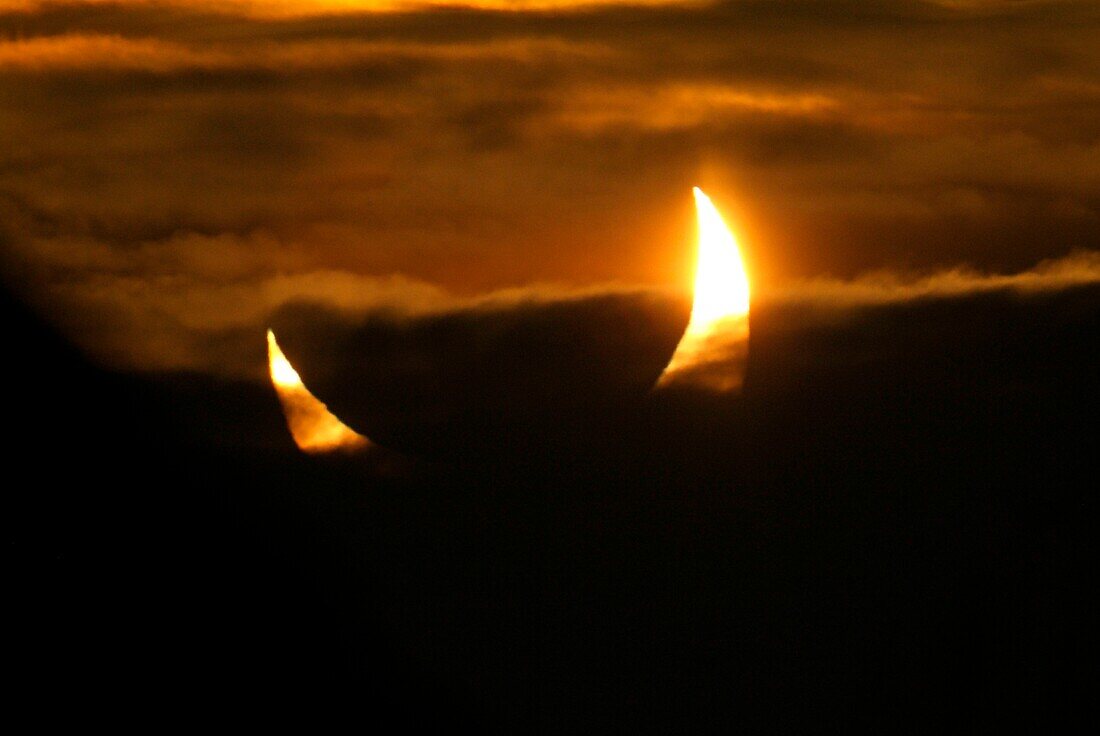 Partial solar eclipse at sunrise