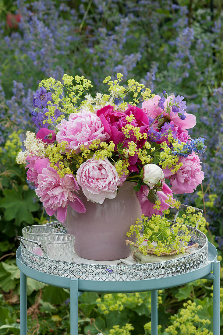 Peony bouquet with lady's mantle, cranesbill, meadowsweet and viper's bugloss