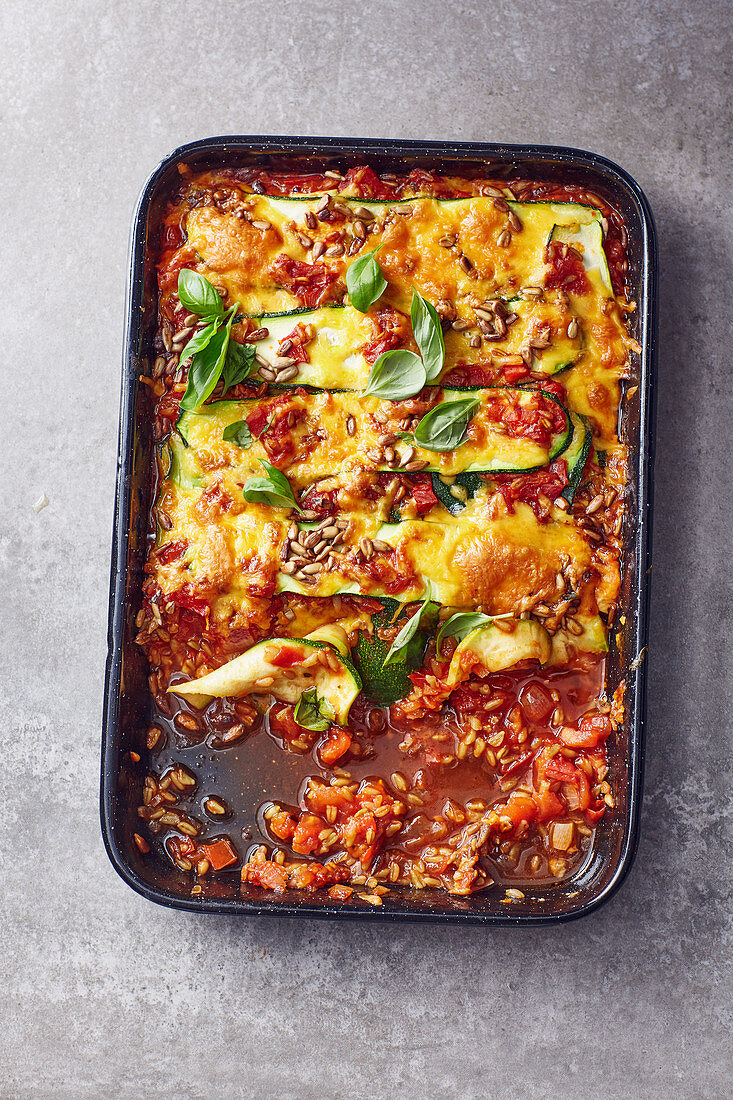 Courgette lasagne with sunflower seeds and Cheddar cheese
