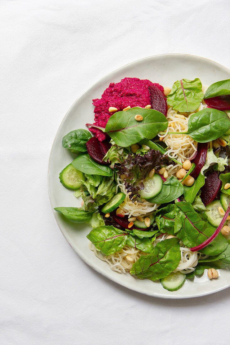 Rice noodle salad with beetroot hummus, peanut sauce and herbs