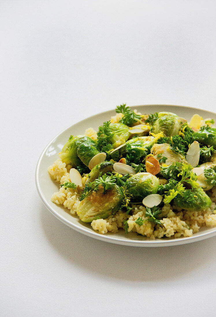 Brussels sprouts in a garlic and parsley coating on lemon couscous