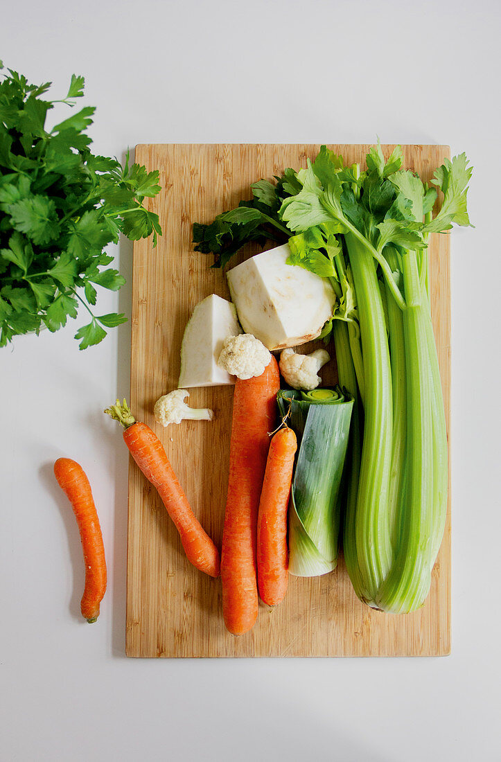 Soup vegetables on a wooden cutting board